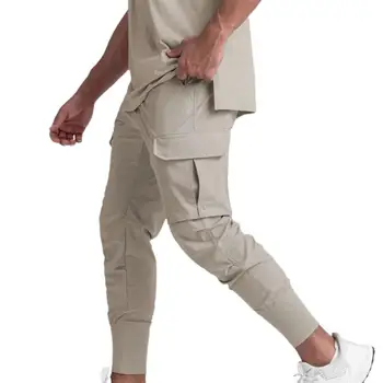 2023 Fitness Vyriškos sportinės kelnės Gatvės apranga Lauko laisvalaikio kelnės Didelio elastingumo vyriškos kelnės Mada Kelių kišenių vyriški drabužiai